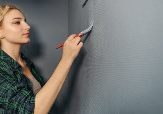 Wall painter applying primer coat on interior wall during professional training at GCC Site Centre for Gulf job market